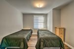 Find 2 twin beds in the third bedroom